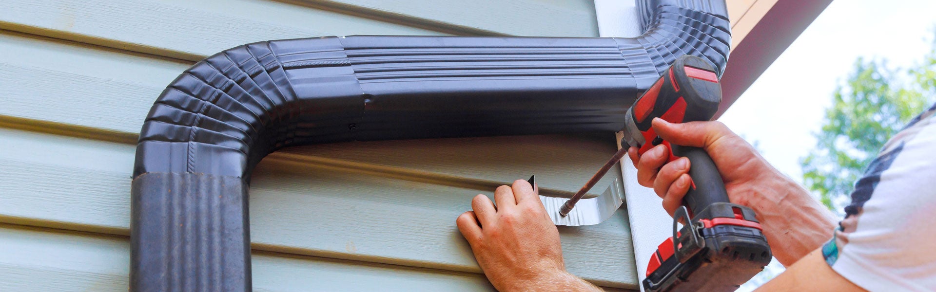 Close-up of gutter installation on home exterior